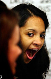 A woman yawns; the rise of sleeplessness in increasingly sophisticated economies such as Britain could lead to the creation of a 'zombie nation'